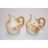 A pair of circa 1900 Royal Worcester blush ivory jugs, each decorated with floral sprays,