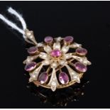 An early 20th century yellow metal amethyst and seed pearl set pendant brooch, 7.3g, 3.