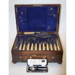 A 1920s oak cased twelve-place setting canteen of silver plated cutlery (incomplete);