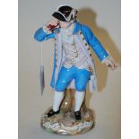 A late 19th century Meissen porcelain figure of a sailor in triform hat raising a telescope to his