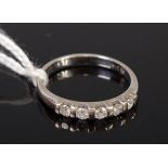 A modern 9ct white gold diamond half eternity ring, total diamond weight 0.25ct, 1.