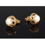 A pair of 18ct gold and cabochon opal set ear studs with screw down backs, 3.5g, dia.