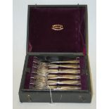 A cased canteen of German white metal six-place setting cutlery,