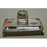 A George V silver inkstand, having gadrooned rim and on scroll feet, maker C S Harris & Sons Ltd,