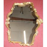 A modern Roroco style gilt framed wall mirror