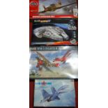 Four various military and sci-fi related plastic kits to include a Revel Easy Kit Milennium Falcon,