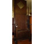 An early 20th century oak hall seat,