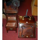 An Edwardian walnut coal purdonium with shovel;