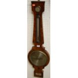 An early 19th century flame mahogany four-dial wheel barometer, signed P.