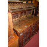 A late 19th century low relief carved oak chiffonier,