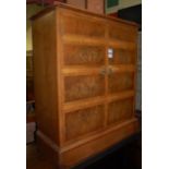 A contemporary burr walnut cross banded and feather banded two door side cupboard,