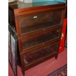 A 1930s mahogany three-tier Globe Wernicke stacking bookcase, having typical hinged glazed doors, w.