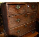 An early 19th century oak squarefront chest of two short over two long drawers, w.