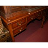 A reproduction yew wood kneehole five drawer dressing table, w.