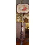 A William IV rosewood and floral needlework inset pole screen,
