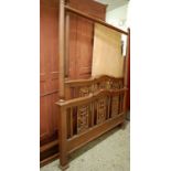 A contemporary Indonesian teak full tester bed, having floral carved details, side-rails, slats,