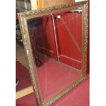 A gilt framed and bevelled wall mirror