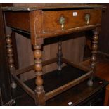 An 18th century provincial joined oak single drawer side table, raised on bobbin turned supports, w.