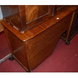A mid-20th century walnut canteen trolley, having twin hinged compartment with fitted interior, w.