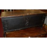 An antique stained elm and pine hinge-top blanket box, having blind carved spiral front panel, w.