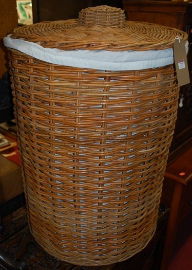 A large wicker circular laundry box and cover, dia.
