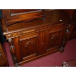 A 19th century pitched pine double door side cupboard, having carved corbel column, w.