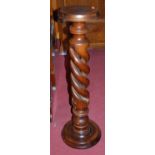 A contemporary hardwood spiral turned plant stand, h.