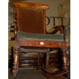 A Victorian mahogany panelled seat rocking elbow chair
