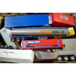 A tray of mixed mainly plastic large scale road transport vehicles and trailers,