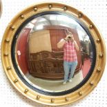 A reproduction Regency style gilt framed circular convex wall mirror, dia. 56.