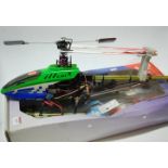 A boxed radio controlled Ikarus E sky radio controlled helicopter with various acessories