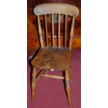 A set of four early 20th century elm seat and beech stickback kitchen chairs