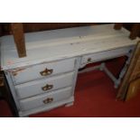 A contemporary painted kneehole dressing table, having an arrangement of four drawers, w.
