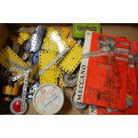 A small quantity of 1980s blue and yellow Meccano sold with a quantity of Meccano brochures to