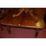 A mid-Victorian mahogany round cornered extending dining table,