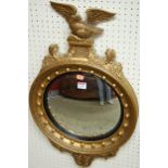 A reproduction Regency style gilt framed convex wall mirror,