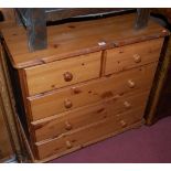 A modern pine round cornered chest of two short over three long drawers, w.