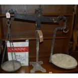 A set of early 20th century cast iron weighing scales