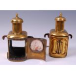 A pair of George III brass coaching lanterns, each with flattened hook shaped bracket,