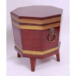 *A Regency mahogany and brass bound cellaret, of slightly tapering octagonal form,