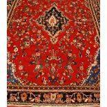 A Persian woollen carpet,