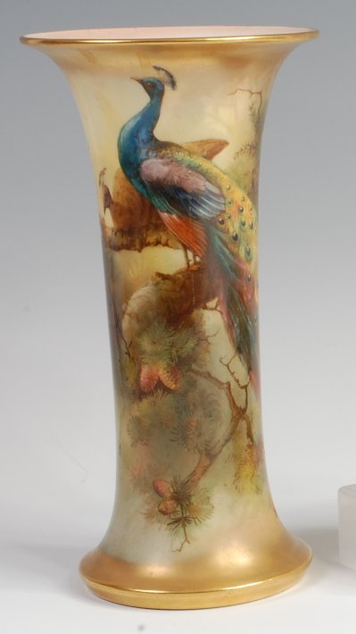 A Royal Worcester porcelain vase, decorated by Walter Sedgley with peacocks upon a pine branch,