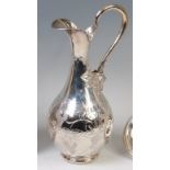 A 20th century Turkish silver wine jug, having scroll handle, applied floral leaf cast decoration,