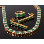 An Indian 20ct gold, emerald and diamond garniture, comprising necklace, pair of ear pendants,