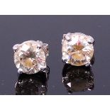 A pair of 18ct white gold and diamond set ear studs,