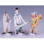 A Meissen porcelain three-piece clown orchestra, modelled by Peter Strang, comprising guitarist,