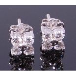 A pair of 18ct white gold diamond ear studs,