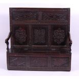 *A circa 1700 joined oak boxseat settle, having a carved panelled back and square cut arms,