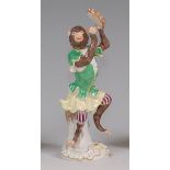 A modern Meissen porcelain monkey band figure, after the original by Johann Joachim Kändler,