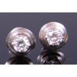 A pair of contemporary white metal diamond ear studs,